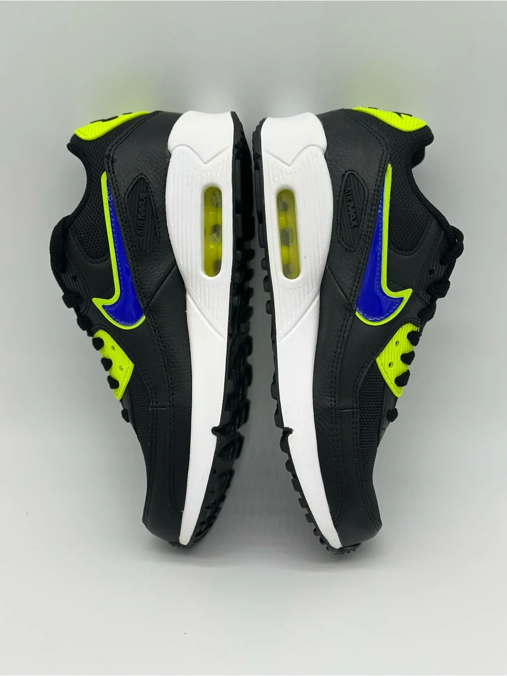 Nike Kids Black Sneakers with Neon Yellow and Blue Swoosh